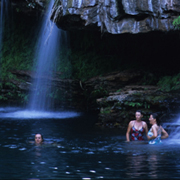 Waterfall hitting water in swimming hole at Karijini National Park