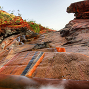 stunning orange and black colours on rock face Karijini National Park